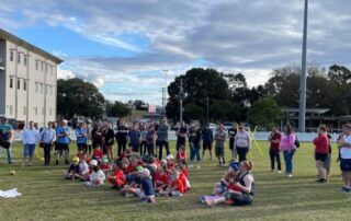 Group of children with adults at a Deaf AFL Auskick program in Queensland
