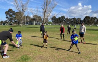 Group of children with adults at a Deaf AFL Auskick program in Victoria